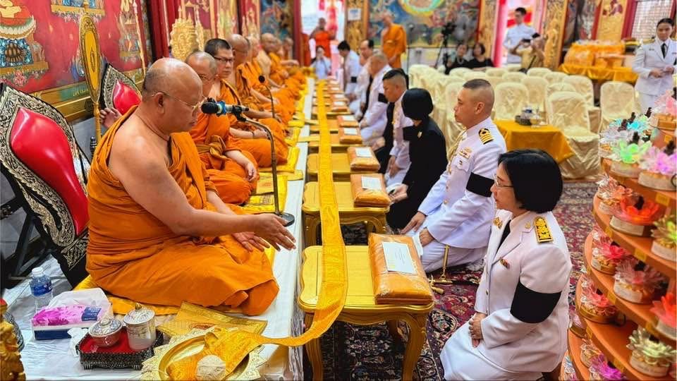 Embassy representatives in prayer with the Sangha